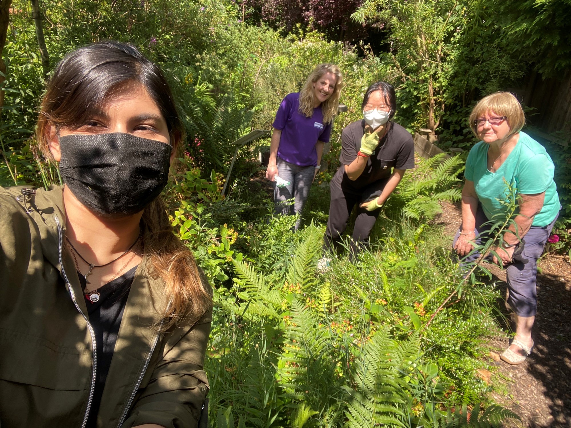 Selfie of students and congregation working on wildlife garden